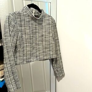Cropped houndstooth mock neck blouse